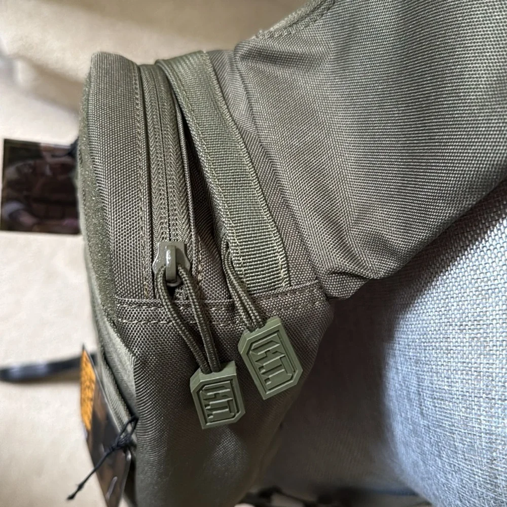 Tactical Sling Bag - Olive Green. Multiple pockets. Spacious compartments.